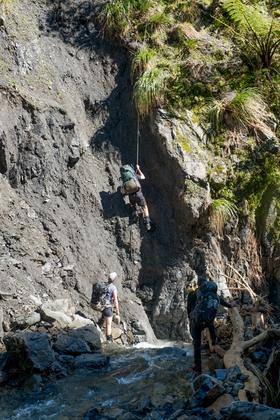 Tony leading the way up the rope with Illona and Jessie looking on. Photo: Ian Harrison