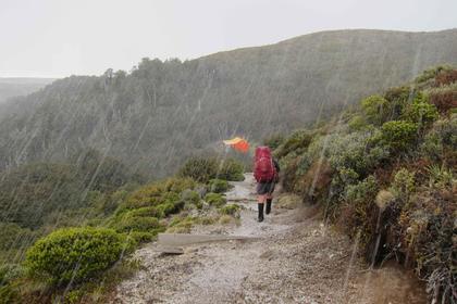 Emily dashes through the hail to Te Puke Hut. Photo credit: Aimee.
