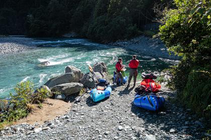 Packing rafts at the roadend launching point Hollyford River