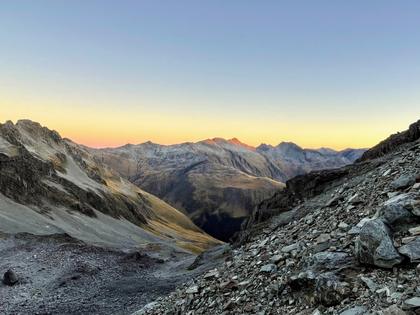Dawn alpenglow from the scree slopes of Gloriana Peak. Totally worth the 3:30am alarm clock. (Photo credit: Emily).