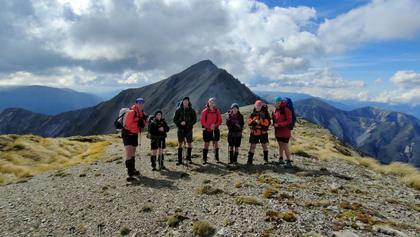 Photo credit: Delia. Team with Te Atuaoparapara behind.