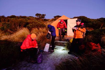 Trampers eating breakfast at Tarn Bivvy