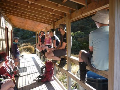 We arrive at Granity Pass hut in the early afternoon and enjoy the sunshine whilst discussing whether to head on to camp further up or whether to stay at the hut. Emily encourages us all by reminding us that there are not many opportunities where we are in such a great location in good weather. We don’t take too much persuading to carry on to find a cold but scenic camp spot for the night
