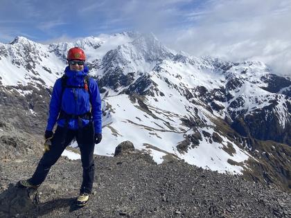 Elisabet on the summit of Avalanche Peak. Mt Rolleston and Rome Ridge slightly obscured behind