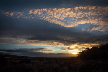 The sun setting on the track back to the Chateau from Tama Lakes