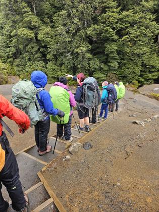 Group descending steps (after lunch at Waihohonu snow shower!)