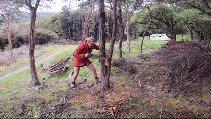 Sarah on her way to winning the firewood sawing competition