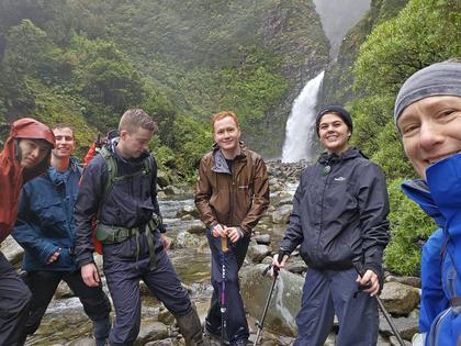 Group selfie in front of the towering Bells Falls