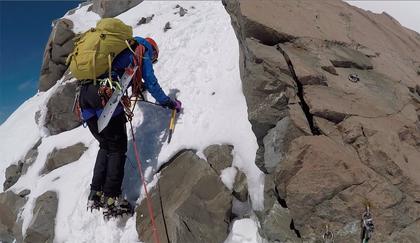 Elisabet down climbs the first section of the Summit Rocks to the first of the bolted anchor points
