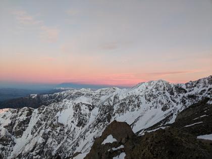 Sunrise over snow covered mountains