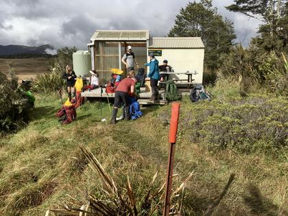 Six trampers at a hut