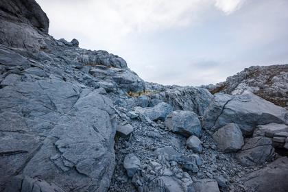 Some easy grass ledges through the karst - when you can find them