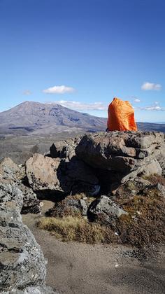 Bothy bag on a summit rock of Pukekaikiore for a lunch shelter