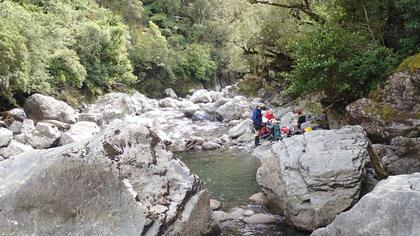 A snack break before the steep climb to Cattle Ridge Hut. Photo credit: David