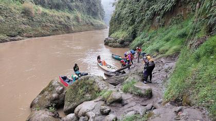 Muddy riverbank at our morning tea break